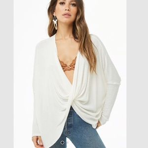 white cross cross white sweater